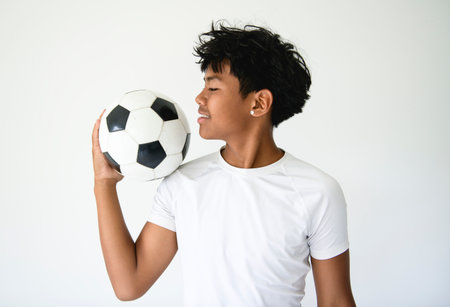 nice Boy with soccer ball on studio white backgroundの写真素材
