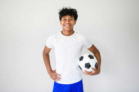 nice Boy with soccer ball on studio white backgroundの写真素材
