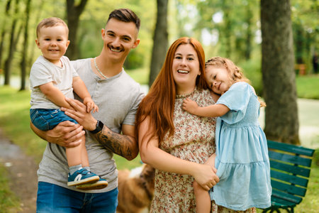 Beautiful happy family enjoying in the parkの写真素材
