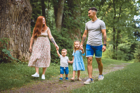 Beautiful happy family enjoying in the park