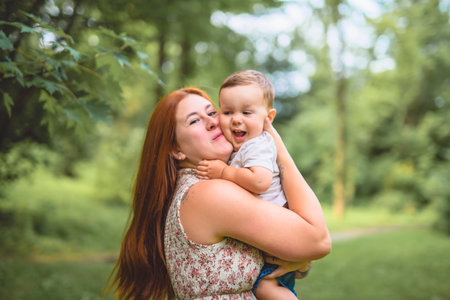 Mother having great time with her son in the forestの写真素材