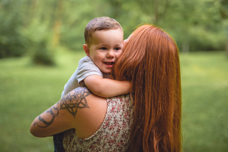 Mother having great time with her son on forestの写真素材