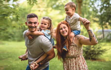 Beautiful happy family enjoying in the park