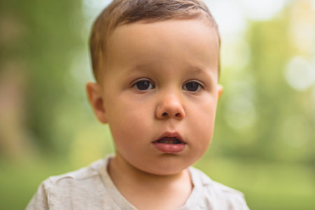 cute little baby boy portrait on forest