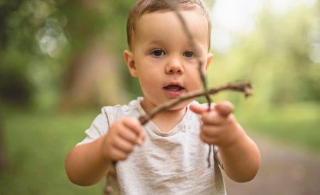 cute little baby boy portrait on forestの写真素材
