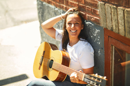 woman playing guitarの写真素材