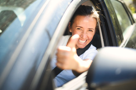 woman at car window drive a new car