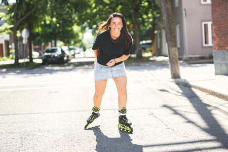 woman inline skates in an urban park, doing exciting skating session