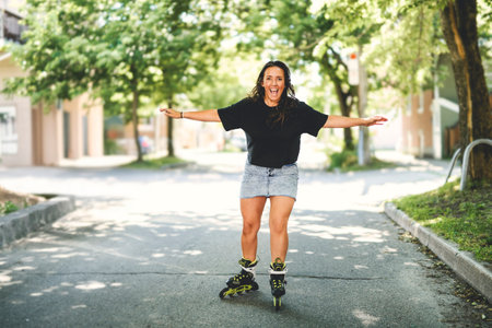 woman inline skates in an urban park, doing exciting skating session