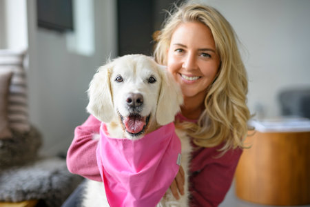 Teen Girl with her golden retreiver dog at home