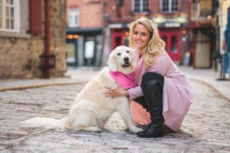Portrait of woman with dog golden retriever in city outside
