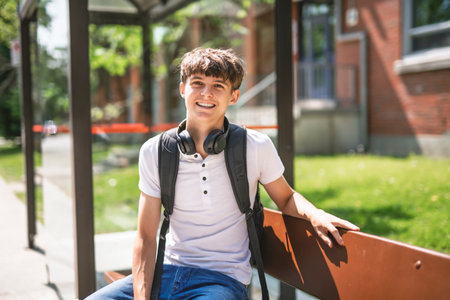 Portrait of smiling elementary school boy with his backpackの写真素材
