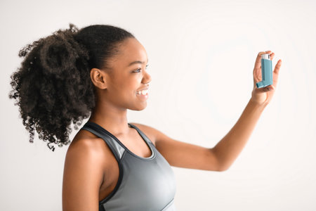 Woman, asthma pump inhaler for medical solution, respiratory or breathing.の写真素材