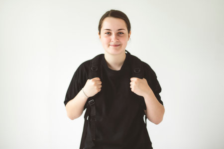 15 years old student teen girl on studio gray