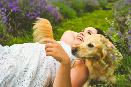 woman with golden retriever on a lavender field