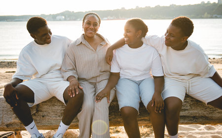 Portrait of big family on beach at the sunsetの写真素材