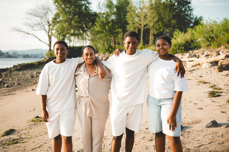 Portrait of big family on beach at the sunset
