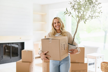 female moving from home house to her new apartmentの写真素材