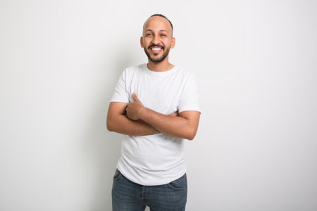 young arab man against white studio wallの写真素材