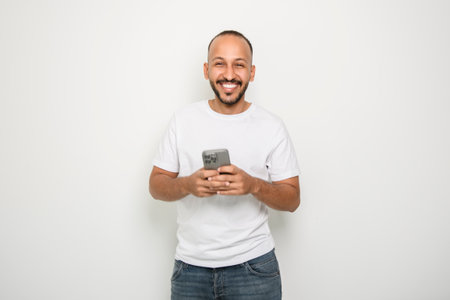 young arab man against white studio wallの写真素材