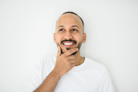 young arab man against white studio wallの写真素材