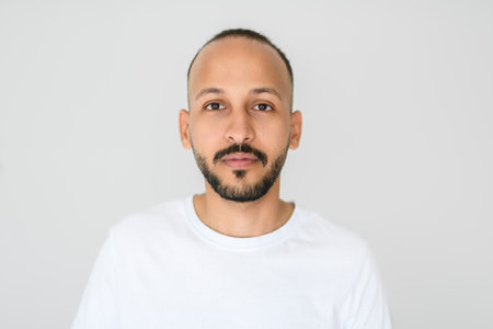 young man against white studio wallの写真素材