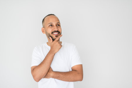 young arab man against white studio wall