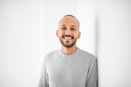 young islamic arab man against white studio wallの写真素材