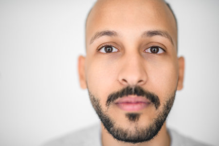 young islamic arab man against white studio wallの写真素材