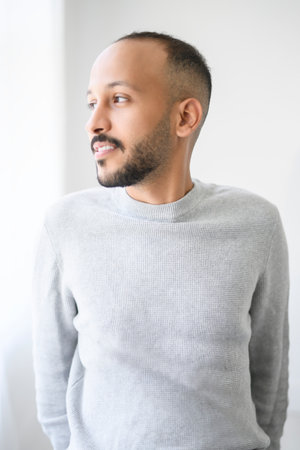 young arab man against white studio wallの写真素材
