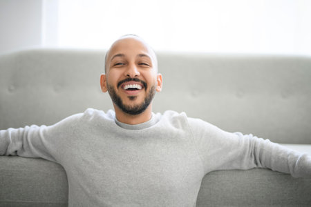 young arab man against white studio wall