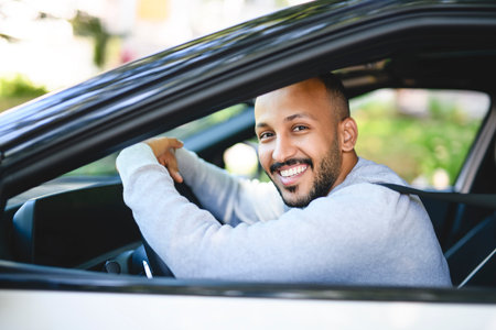young arab man with his new carの写真素材