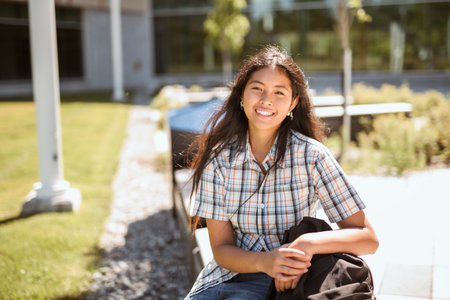 Happy teen high school student outside on summer seasonの写真素材