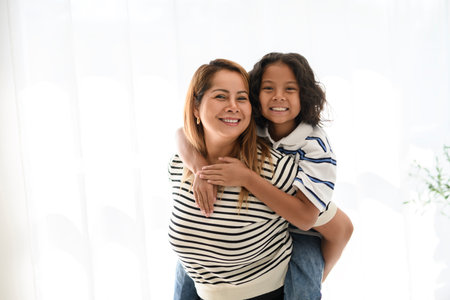 9 years thailand boy having great time at home with his mother