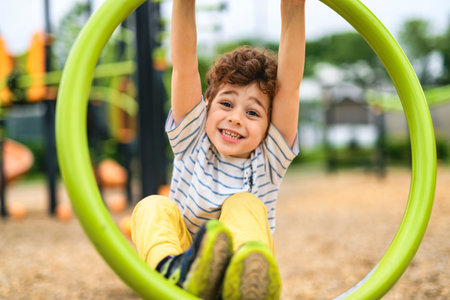 Happy kid on playground on summer seasonの写真素材