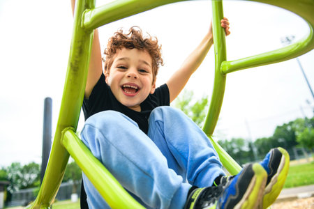 Happy kid on playground on summer seasonの写真素材