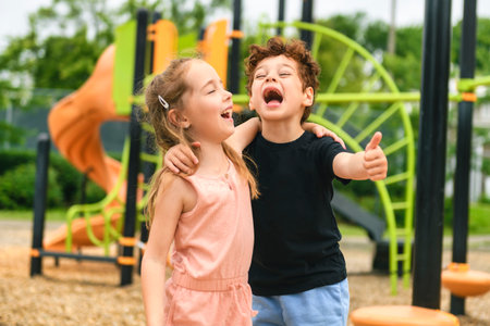 Happy kids on playground in summer seasonの写真素材