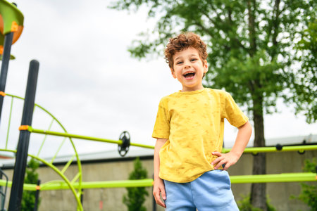 Happy kid on playground on summer season