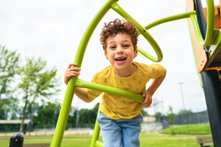 Happy kid on playground on summer seasonの写真素材