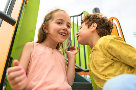 Happy kids on playground in summer seasonの写真素材