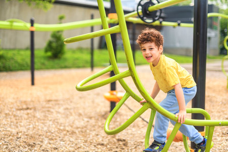 Happy kid on playground on summer season