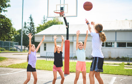 Childs girls Team in sportswear playing basketball gameの写真素材