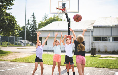 Childs girls Team in sportswear playing basketball gameの写真素材