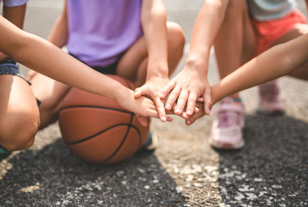 hand over hand view with basketball on the backの写真素材