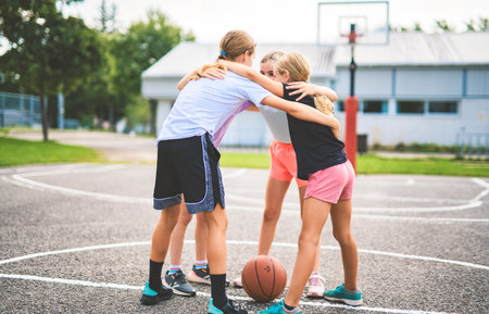 Childs girls Team in sportswear playing basketball gameの写真素材