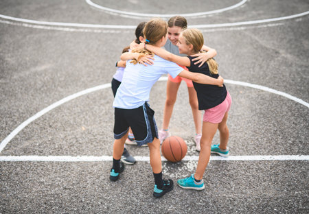 Childs girls Team in sportswear playing basketball gameの写真素材