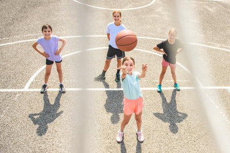Childs girls Team in sportswear playing basketball gameの写真素材