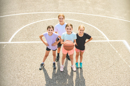 Childs girls Team in sportswear playing basketball gameの写真素材