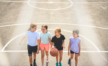 Childs girls Team in sportswear playing basketball gameの写真素材