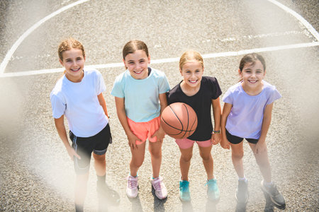 Childs girls Team in sportswear playing basketball gameの写真素材